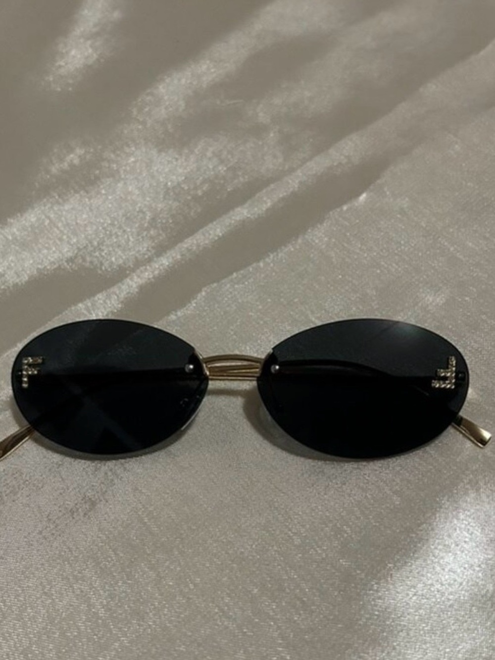 Fendi Gold Frame Oval Sunglasses with Black Lenses